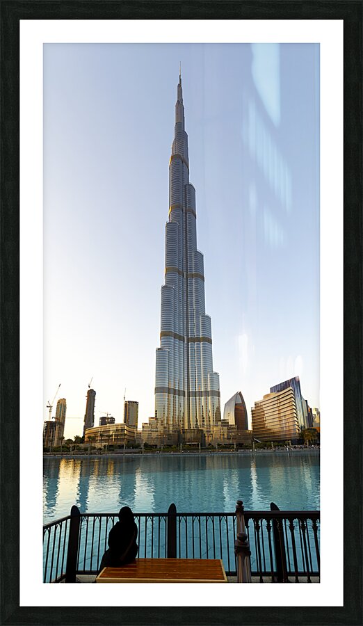 Dubai. UAE. Burj Khalifa. A veiled woman on a bench Picture Frame print
