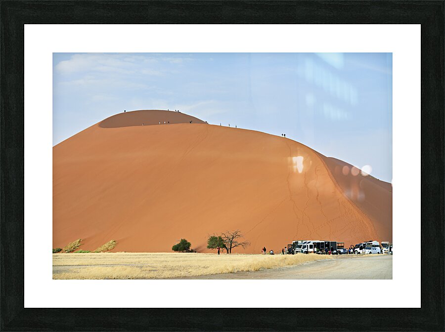 Namibia. Climbing the sand dunes at Sossusvlei. Namib Naukluft National Park Picture Frame print