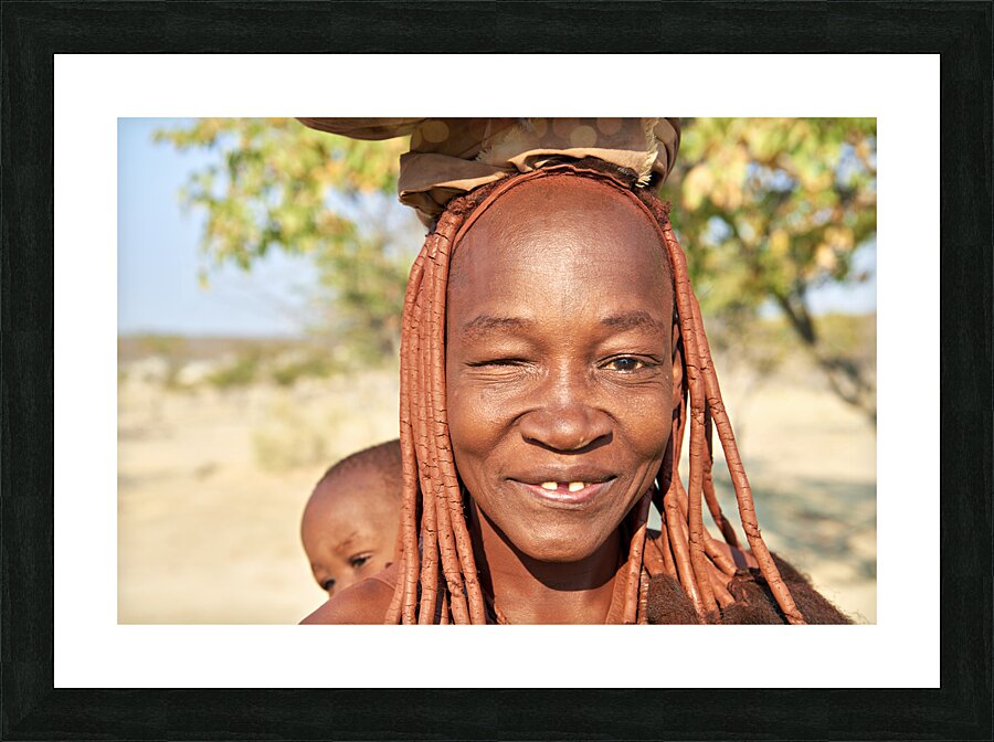 Namibia. Portrait of a smiling Himba woman with her baby in Kunene region Picture Frame print