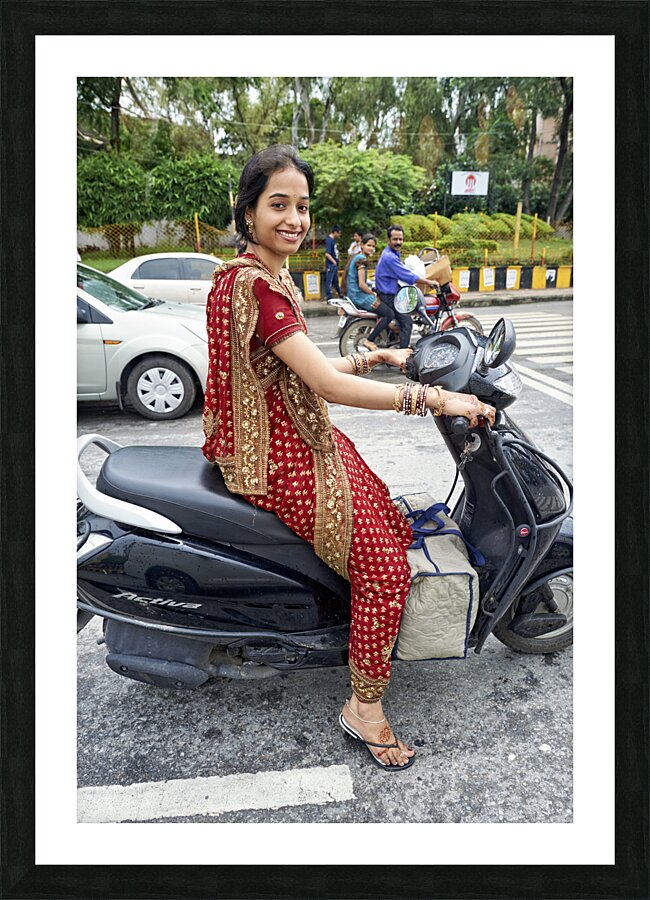 India Rajasthan Udaipur. A beautiful smiling girl on a scooter Picture Frame print