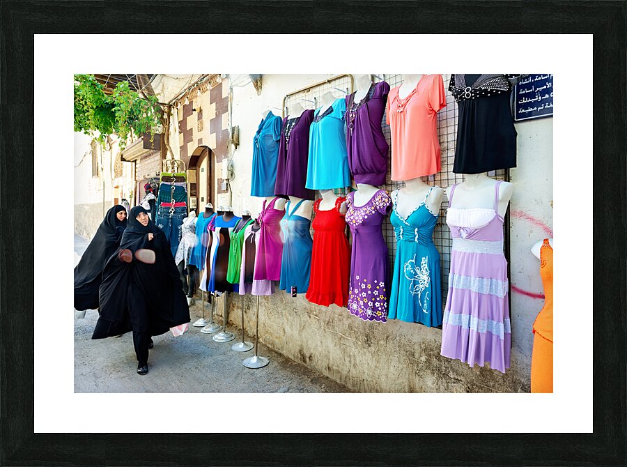 Syria. Damascus. Veiled women looking at western dresses Picture Frame print
