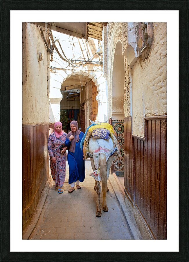 Morocco Fez. Two women walking in the narrow alleys of the Medina Picture Frame print