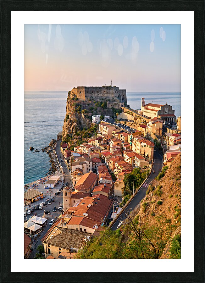 The city of Scilla Calabria Italy. Elevated view of the Ruffo castle at sunset Picture Frame print