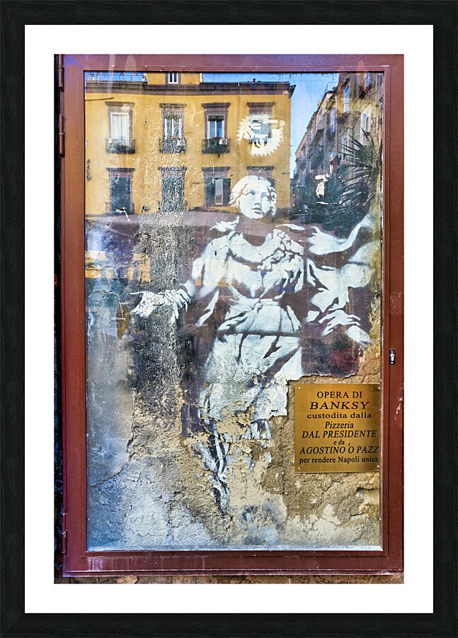Naples Campania Italy. Famous street art by Banksy. Madonna con revolver Mary with gun Picture Frame print