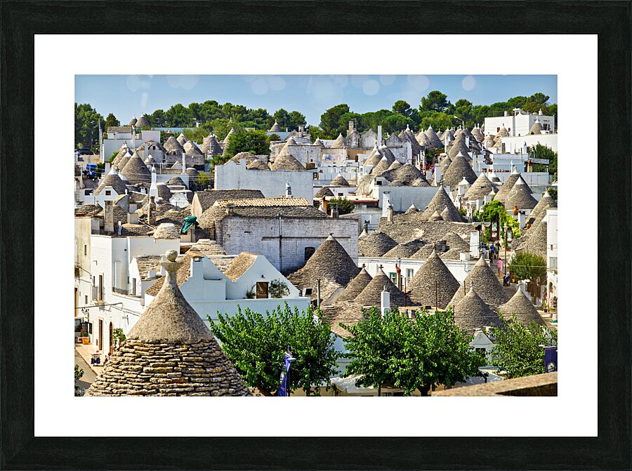 Apulia Puglia Italy. Alberobello. Trulli: traditional Apulian dry stone huts with a conical roof. Picture Frame print