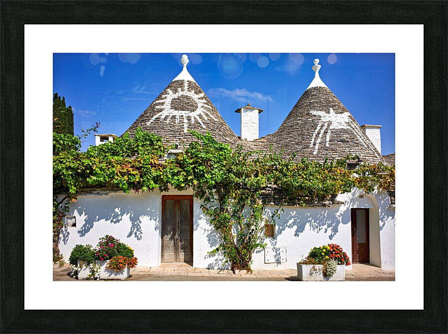 Apulia Puglia Italy. Alberobello. Trulli: traditional Apulian dry stone huts with a conical roof. Picture Frame print