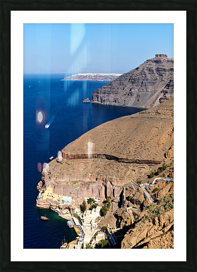 Santorini caldera with cliffs deep blue sea port and distant  Picture Frame print