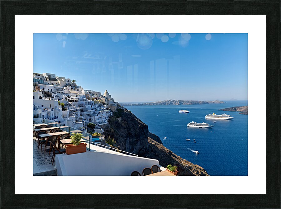 Santorinis white village blue caldera and cruise ships. Picture Frame print
