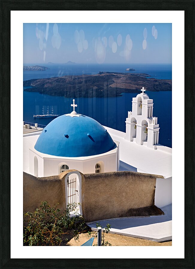 Santorinis iconic blue dome church and caldera seascape. Picture Frame print