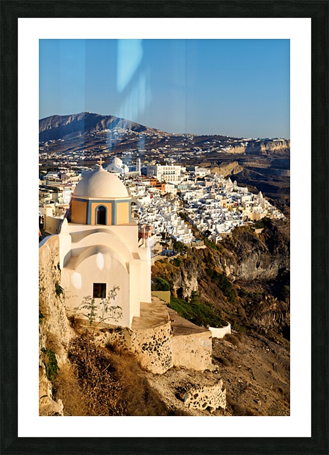 Iconic Santorini village and church overlooking caldera. Picture Frame print