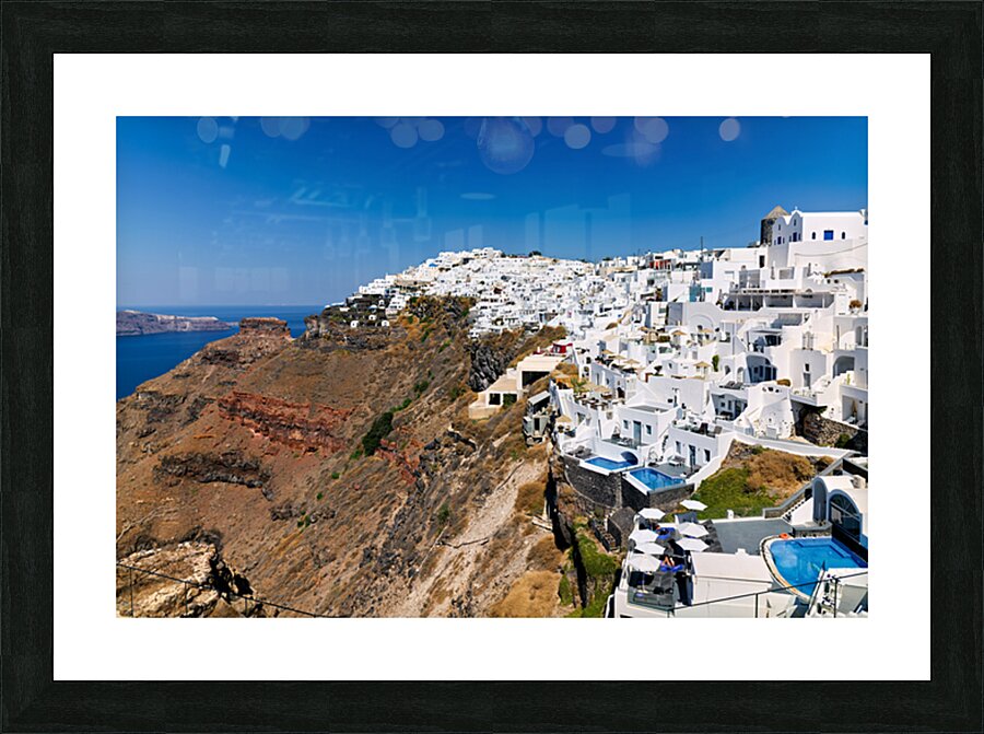 Santorini: White cliffside village blue sea clear sky. Picture Frame print