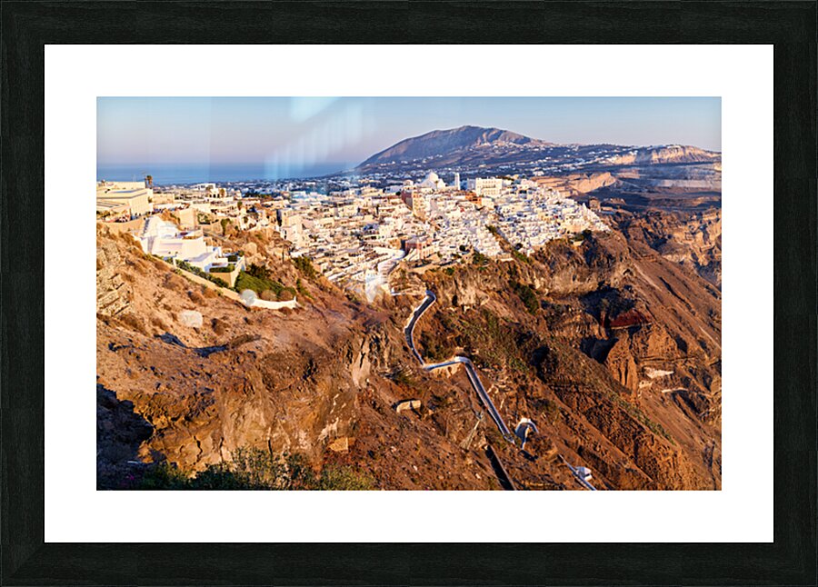 Santorinis Fira town on caldera cliff at sunset. Picture Frame print