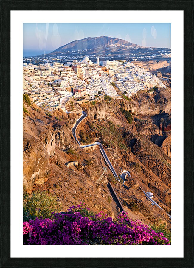 Picturesque Santorini cliffside town with winding path and vibra Picture Frame print