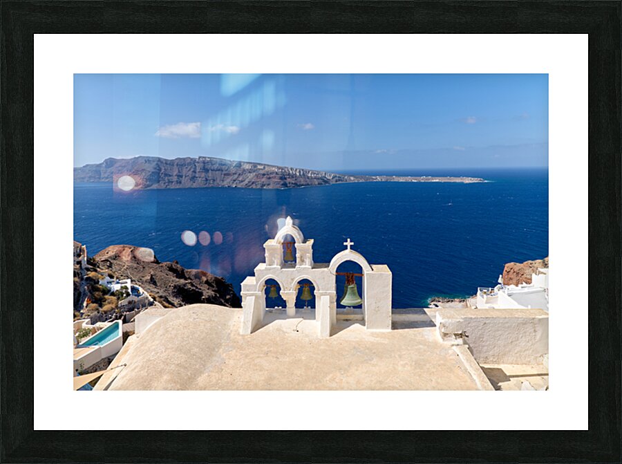 Iconic Santorini bell tower overlooking the caldera and Aegean S Picture Frame print