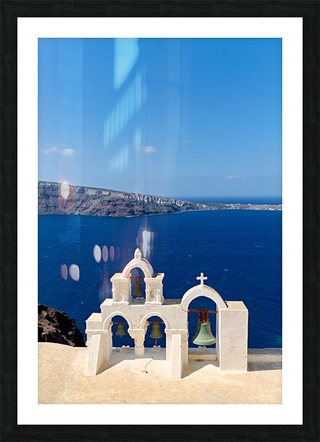 Santorini bell tower overlooking the Aegean Sea. Picture Frame print