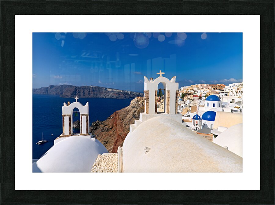 Santorinis iconic white churches blue domes and caldera view. Picture Frame print