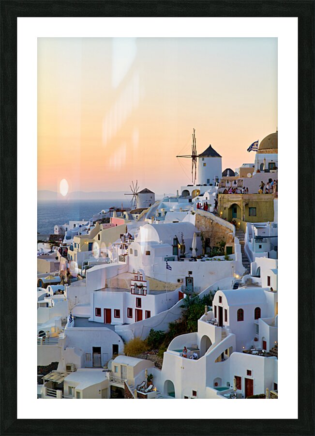 Oia Santorini: White buildings windmills and sunset over the  Picture Frame print
