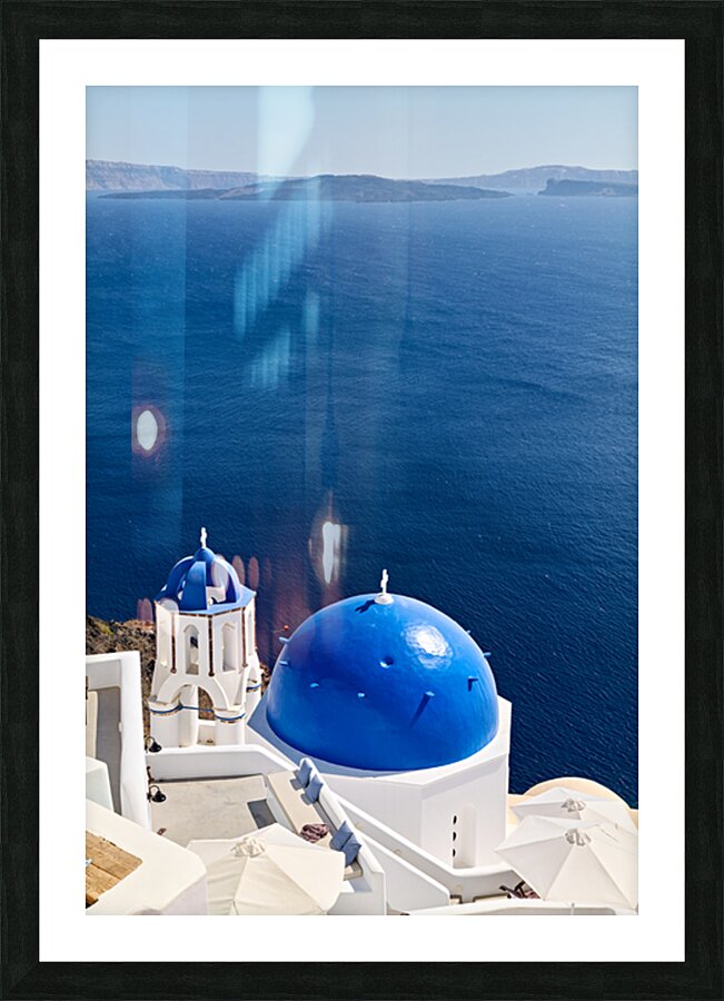 Santorinis blue domes and caldera view. Picture Frame print
