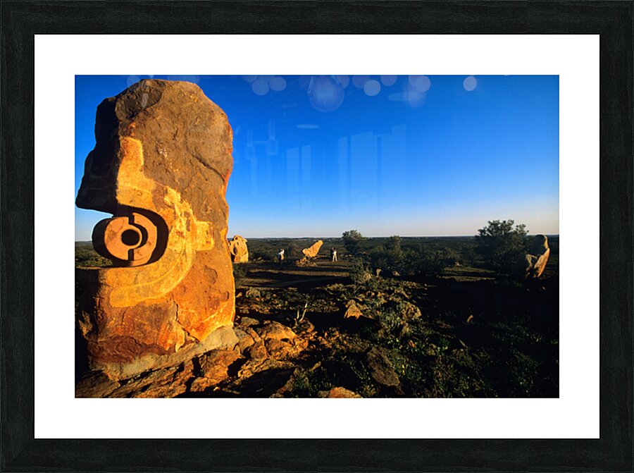 Sandstone sculptures glow at sunset in the Australian outback. Picture Frame print