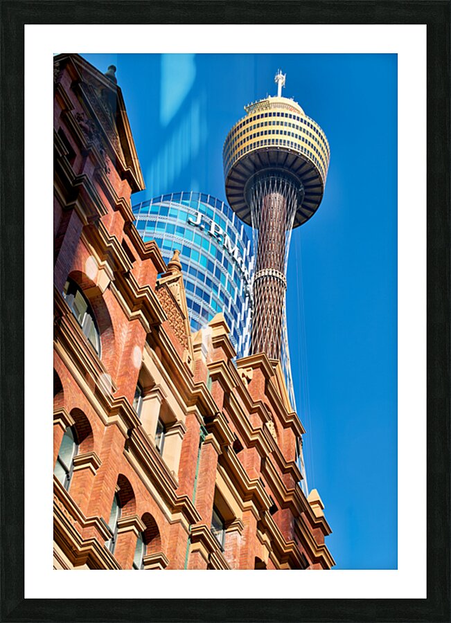 Sydney Tower and J.P. Morgan building against blue sky. Picture Frame print