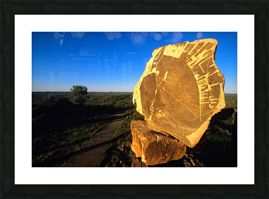 Carved stone monument in the Australian outback at sunset. Picture Frame print