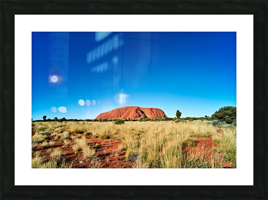 Uluru Australias iconic sandstone monolith under a clear blue Picture Frame print