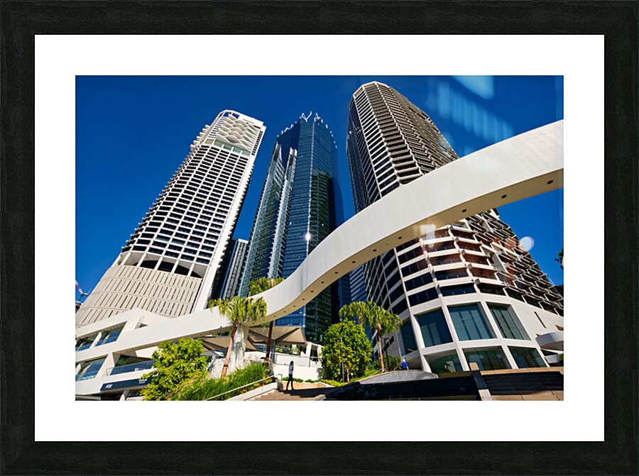 Woman walks on stairs in modern urban area with tall buildings Picture Frame print