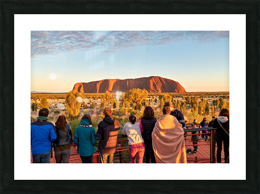 Tourists watch Uluru glow at sunrise. Picture Frame print
