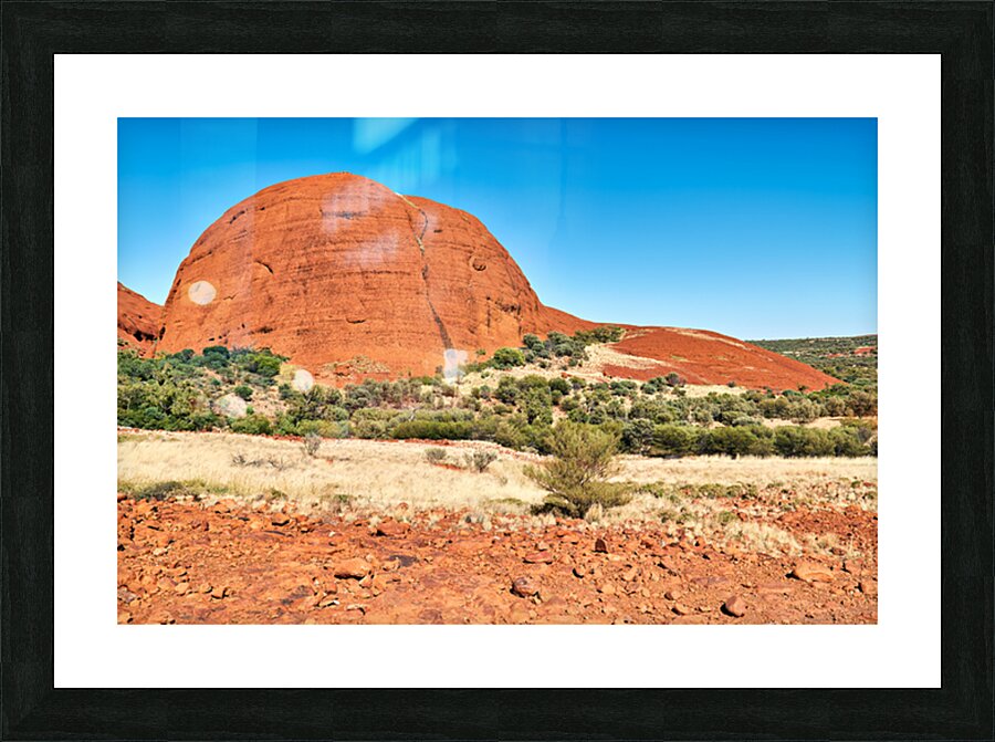 Vast red rock formation under a clear blue sky. Impression et Cadre photo