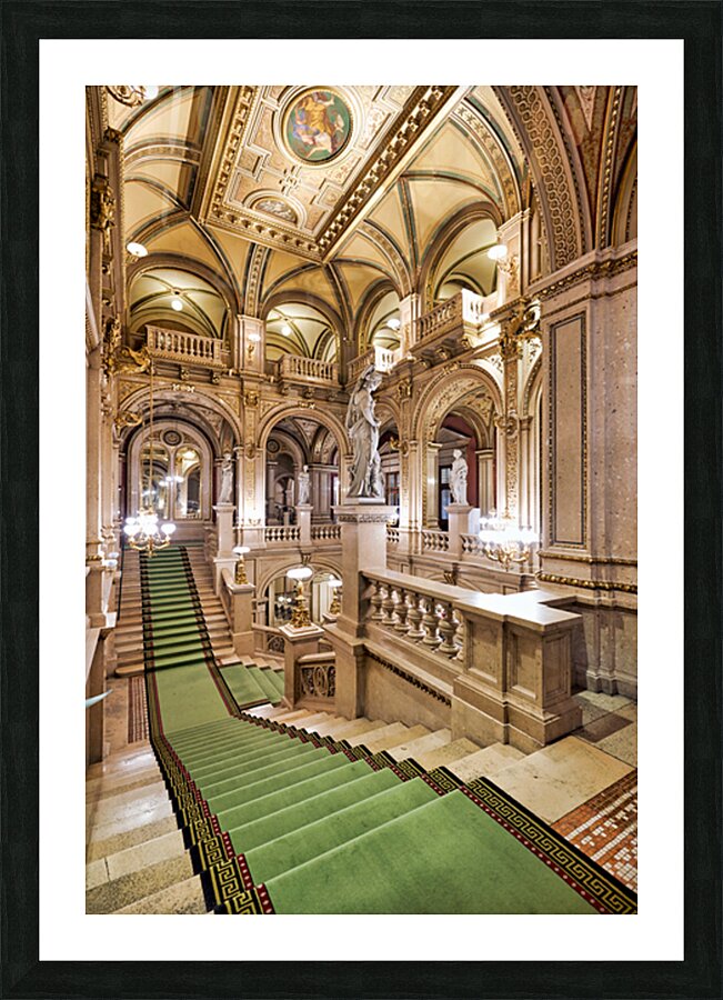 Ornate grand staircase with green carpet and classical statues. Picture Frame print