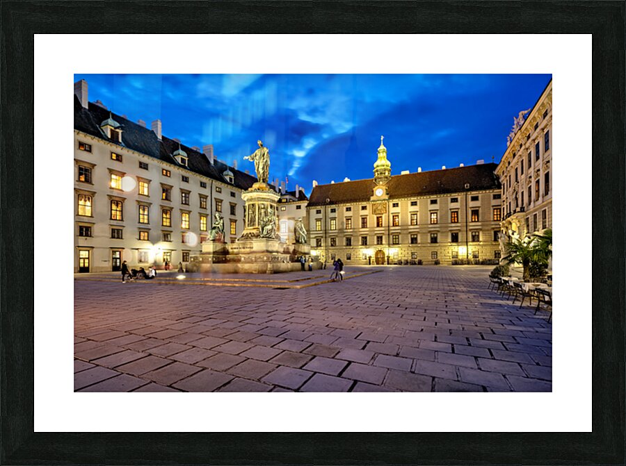 Hofburg Palace square at night with illuminated buildings and st Picture Frame print