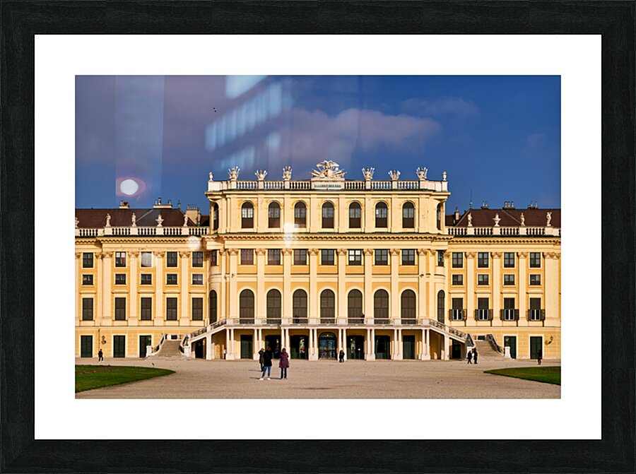 Ornate yellow palace facade with people and blue sky. Picture Frame print