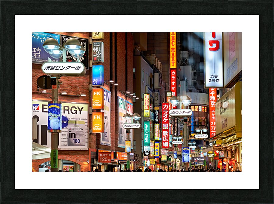 Neon lights shine bright in Shibuya district at night in Tokyo Picture Frame print