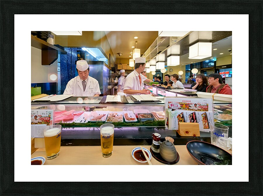 Sushi bar in Shibuya district with chefs and guests enjoying mea Picture Frame print