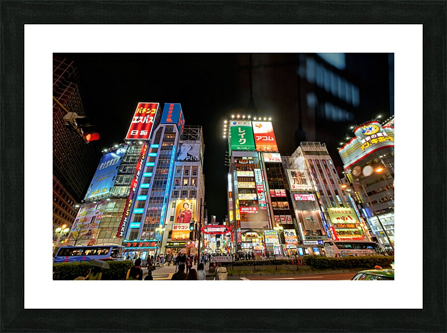 Neon lights shine bright in Shinjuku district of Tokyo at night Picture Frame print