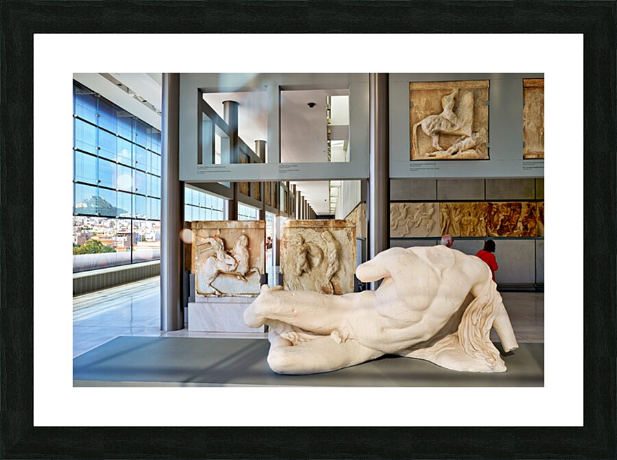 Visitors explore sculptures at Acropolis Museum in Athens Greece Picture Frame print