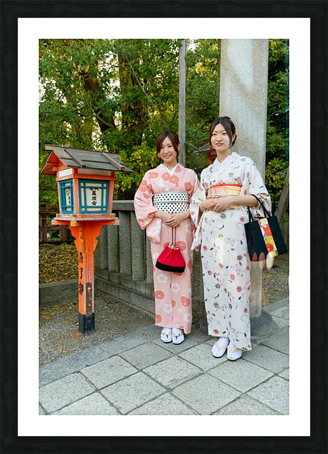 Young women in traditional kimono at Yasaka Shrine in Kyoto Picture Frame print