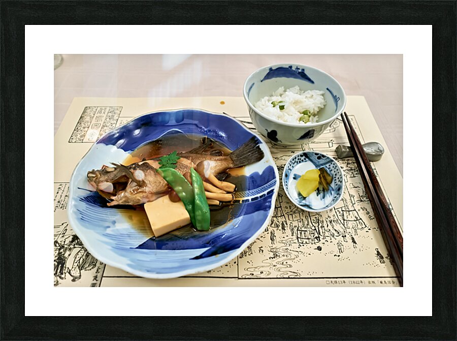 Enjoying traditional Japanese cuisine at a restaurant in Miyajim Picture Frame print