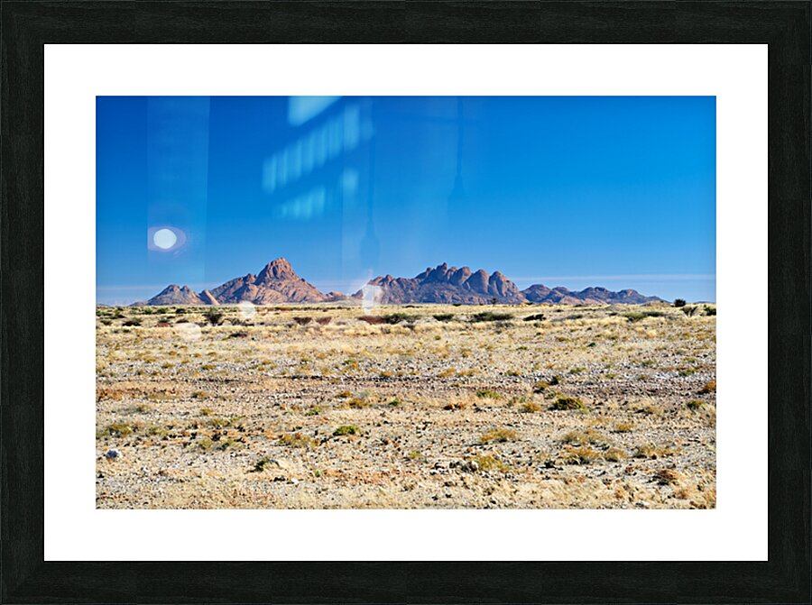 Granite peaks of Spizkoppe rise in Namib Desert landscape Picture Frame print