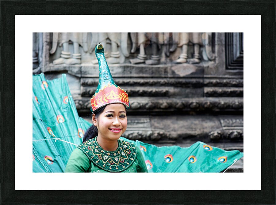 Smiling Cambodian dancer in traditional peacock costume at templ Picture Frame print