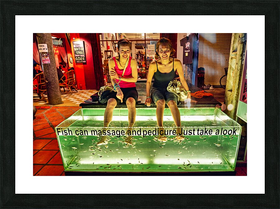 Smiling women enjoy fish foot spa. Picture Frame print