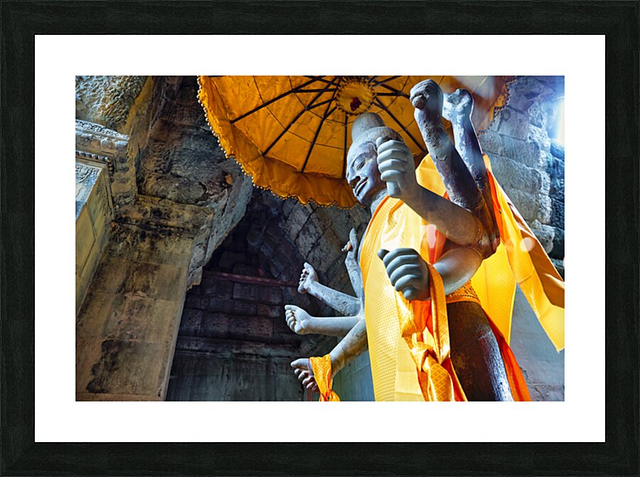 Ancient multi armed statue yellow fabric inside stone temple. Picture Frame print