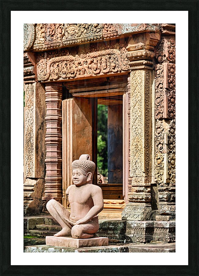 Ancient Cambodian temple with intricate carvings and stone statu Picture Frame print