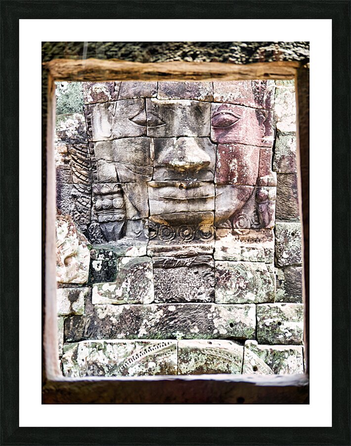Ancient stone face carving framed in temple window. Picture Frame print