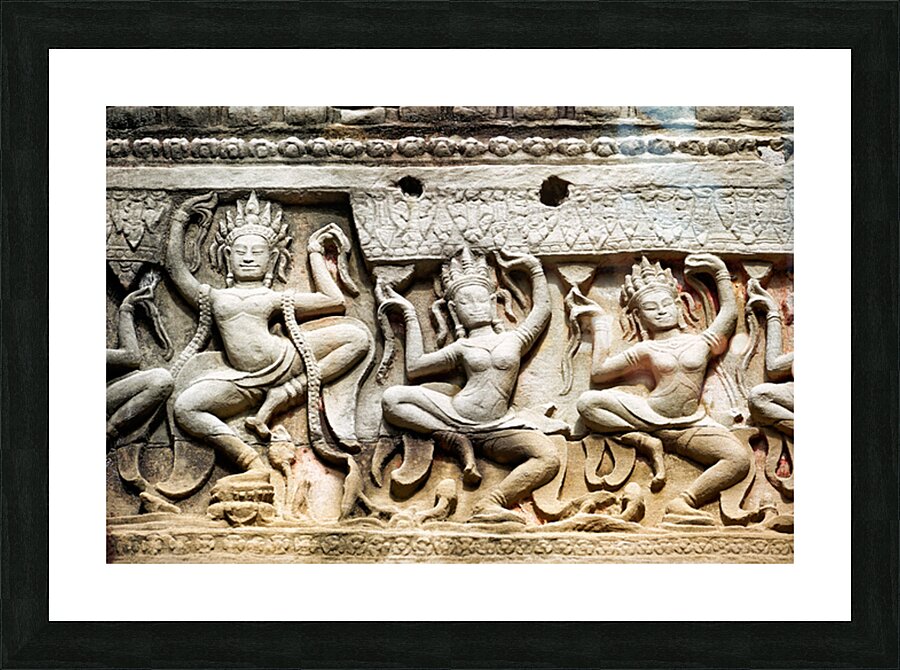 Ancient stone carvings of dancing Apsaras on a temple wall. Picture Frame print