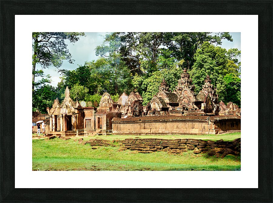 Ancient stone temple complex surrounded by lush jungle and water Picture Frame print