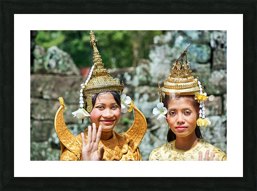 Cambodian dancers in golden attire and elaborate headwear. Picture Frame print