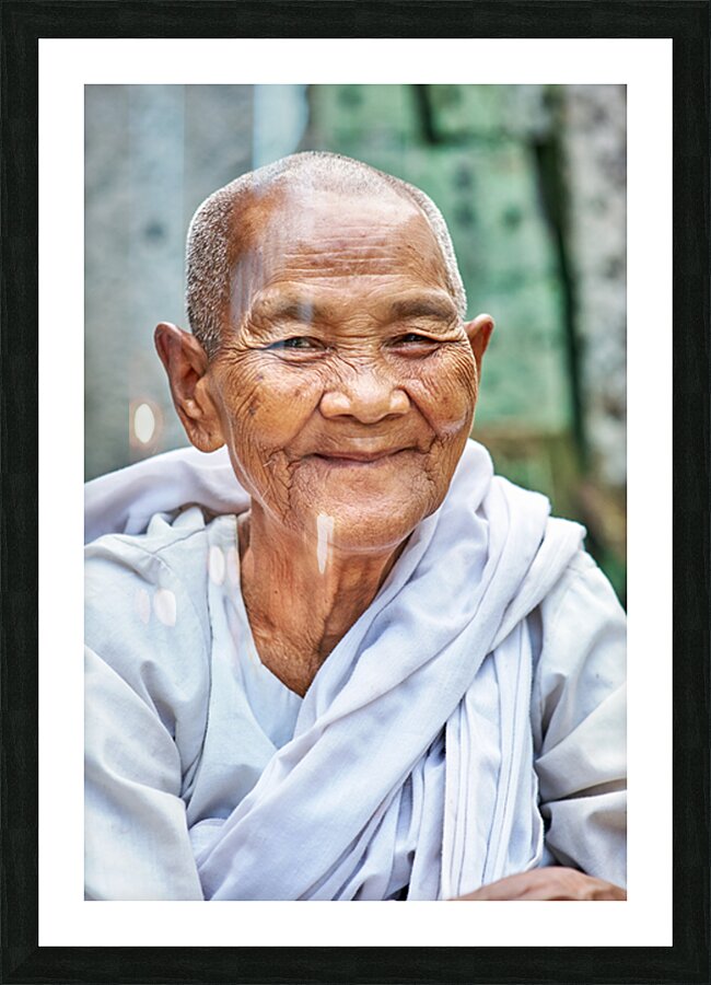 Smiling elderly Asian woman in white robe. Picture Frame print