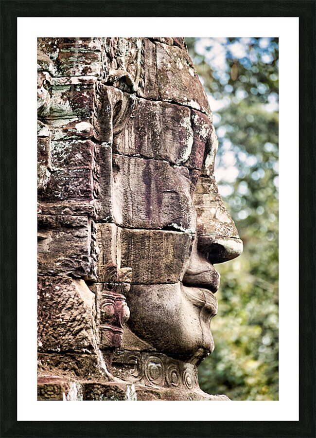 Weathered stone face carving from an ancient temple. Picture Frame print
