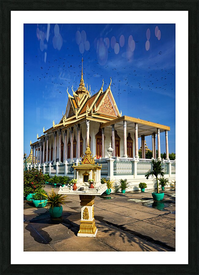 Majestic Cambodian temple under a blue sky with flying birds. Picture Frame print